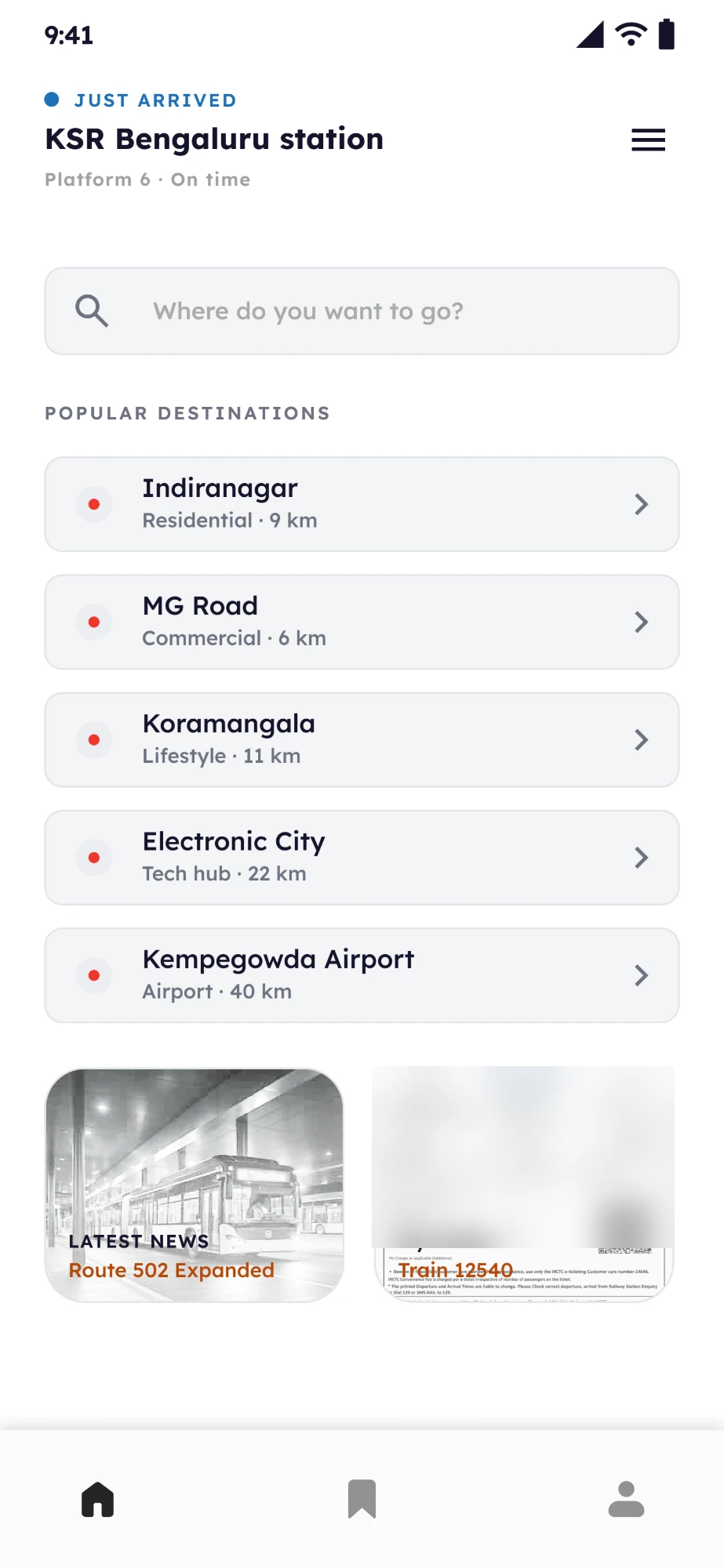 Last Mile destination screen. Just arrived at KSR Bengaluru station, Platform 6, on time. A search field, then popular destinations Indiranagar, MG Road, Koramangala, Electronic City and Kempegowda Airport, then a news card and a ticket card.